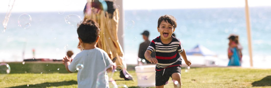 Image of children running in bubbles in Scarborough